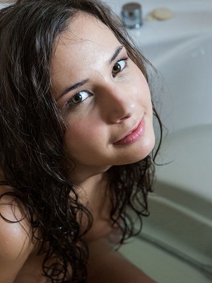 "Oretha Mars teasing looks as she takes a swim in the pool, until she takes a sensual shower on the bathtub."